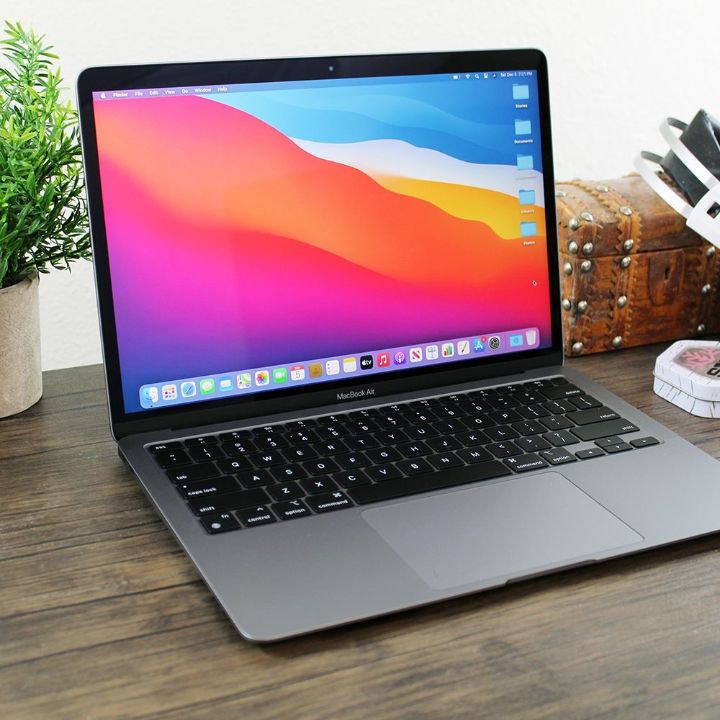 MacBook Pro M1 Silver closed back view with Apple logo and box