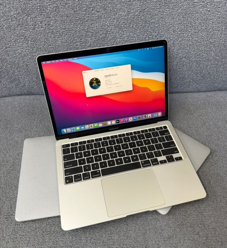 MacBook Air 2017 13-inch open showing macOS display - multiple angles