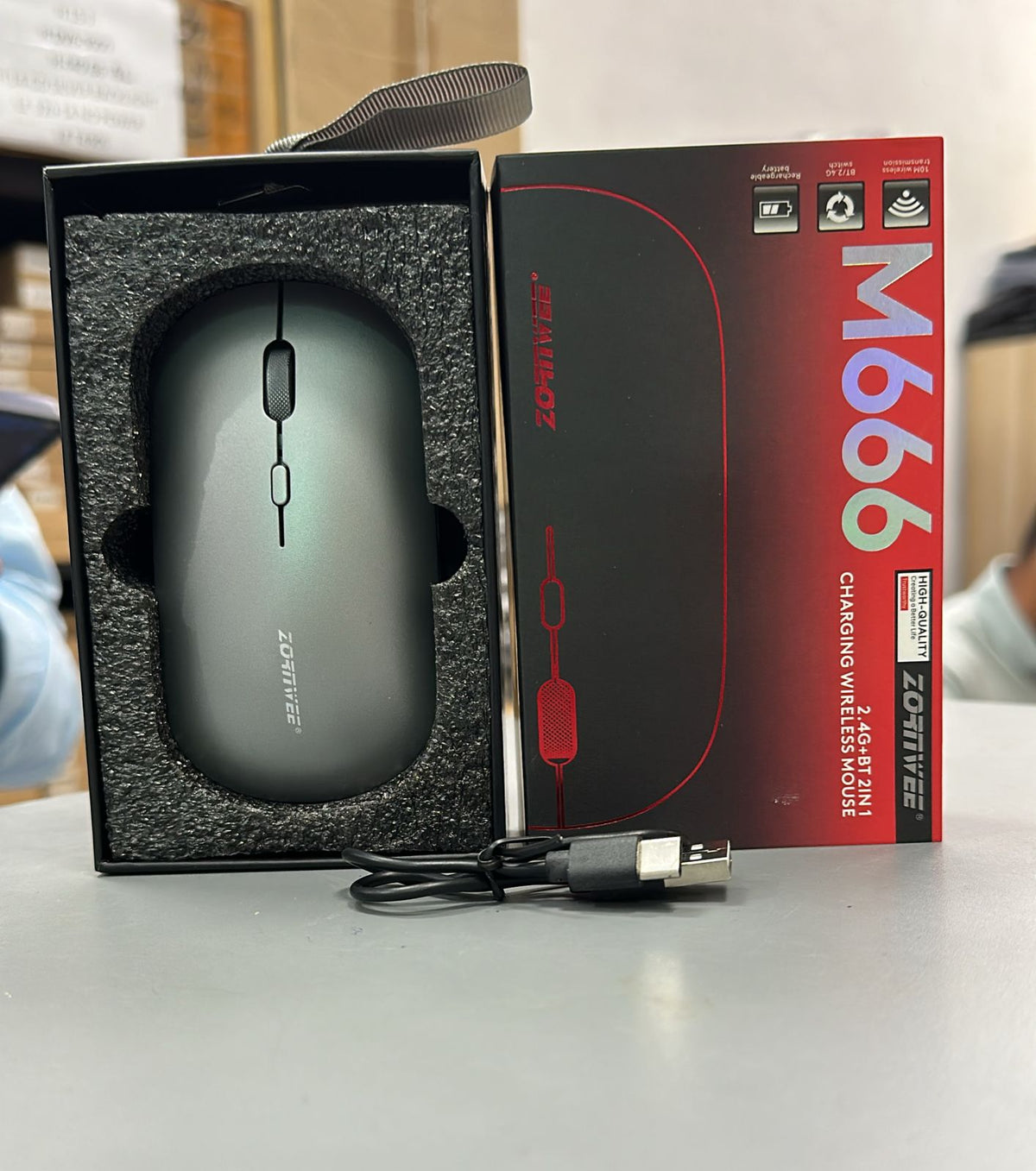Zornwee M666 wireless mouse unboxed in premium black foam packaging with USB-C charging cable and original red black box
