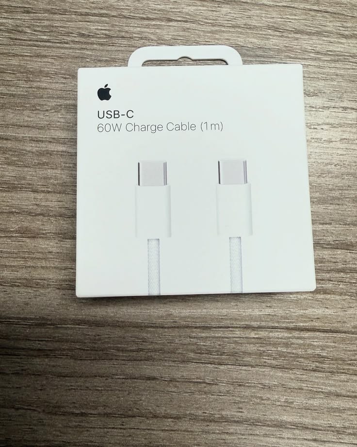 Apple USB-C 60W Charge Cable 1m original white retail box front view on wooden surface