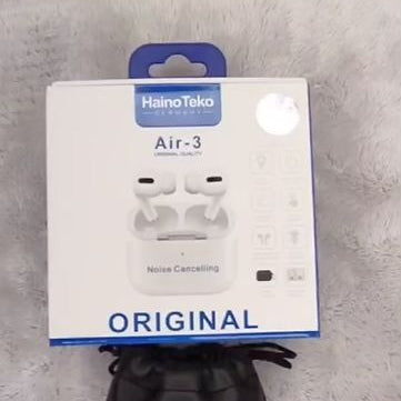 HainoTeko Air-4 original box with premium black HainoTeko carry pouch on white fabric surface