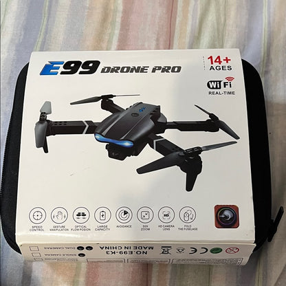 E99 Drone Pro E99-K3 original box front showing black drone with WiFi Real-Time, HD Camera, 50X Zoom, Gesture Manipulation and Obstacle Avoidance features