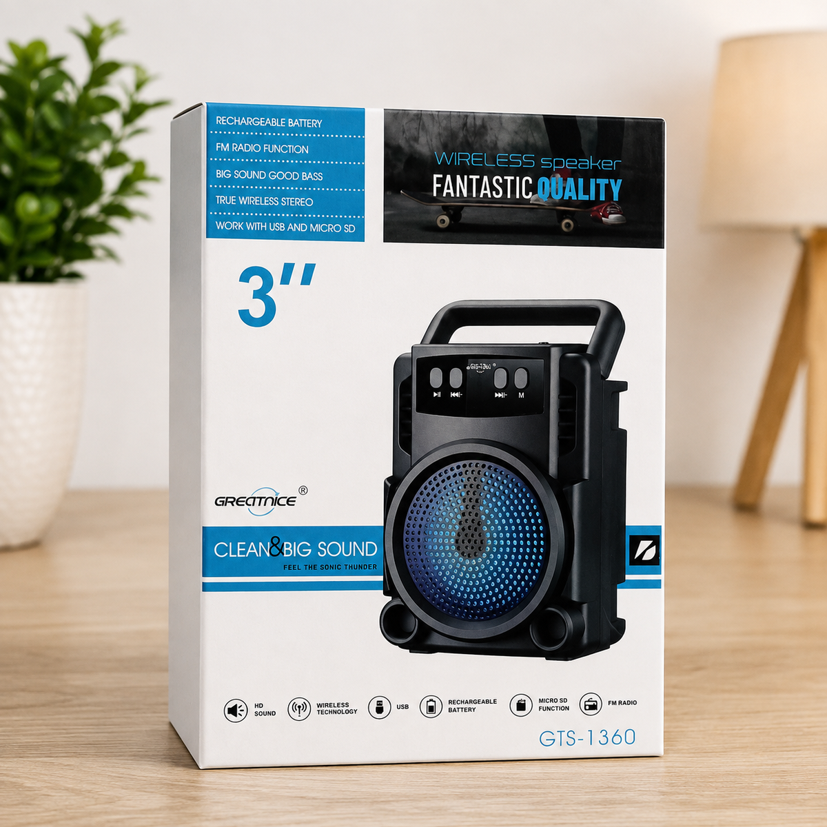 Greatnice GTS-1360 3 inch Bluetooth speaker original retail box on wooden desk with plant and lamp in background showing all features