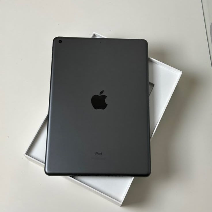 Apple iPad 8th Generation Space Gray back view in original white box on white surface