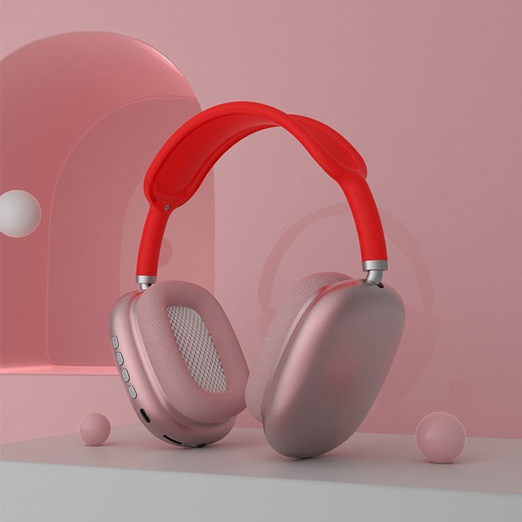 P9 Pro Max wireless headphones pink and red colorway studio shot on pink background with decorative spheres